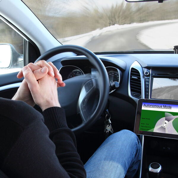 Man in a self driving car