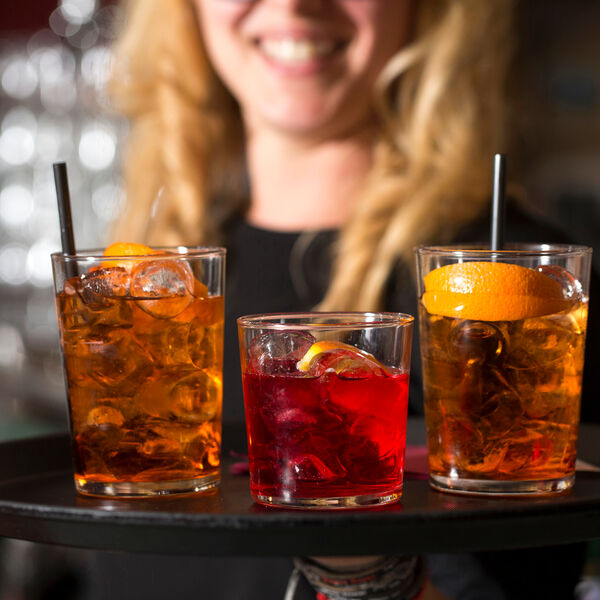 Woman serving drinks on a tray 