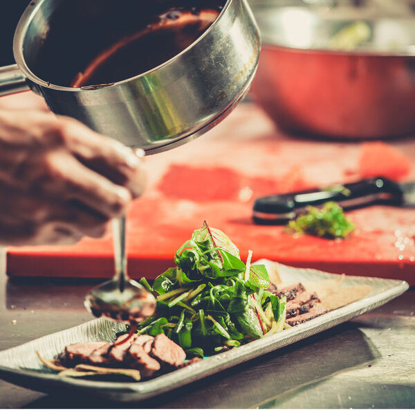 Man plating the food he cooked