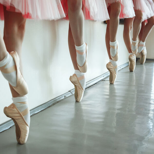 Ballerinas wearing pink tutus in a line