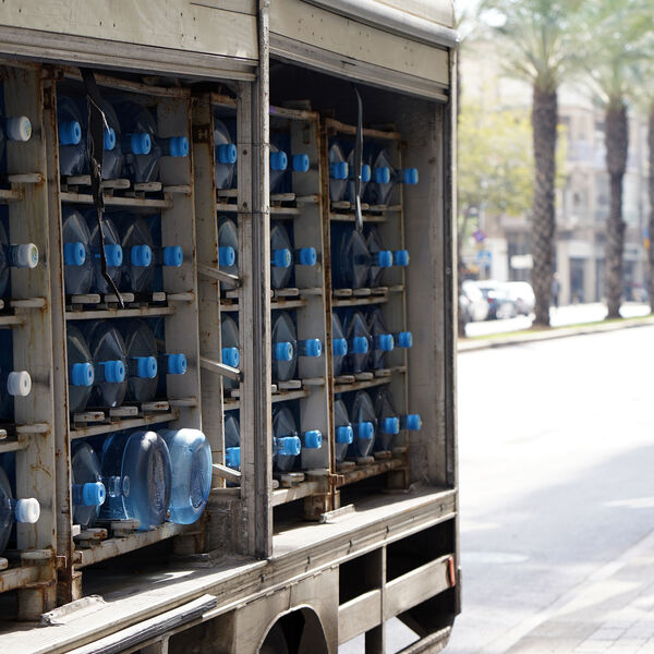 Distribution truck carrying water jugs
