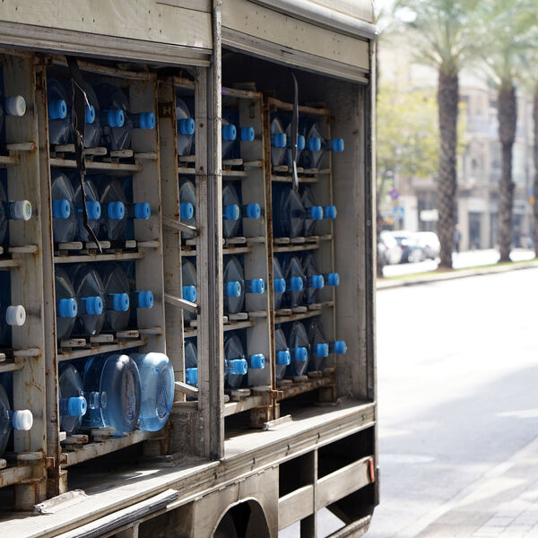 Distribution truck carrying water jugs