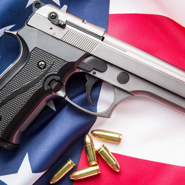 Gun and bullets on top of American flag