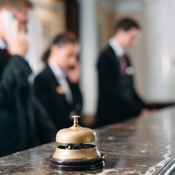 Hotel front desk staff working