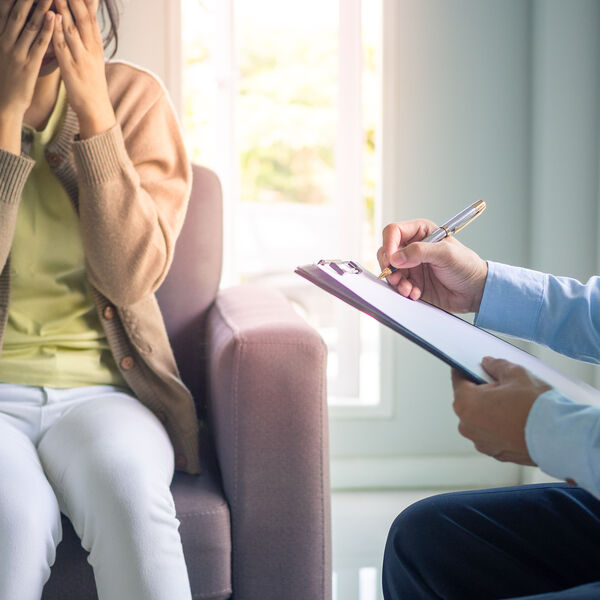 Woman talking to mental health professional