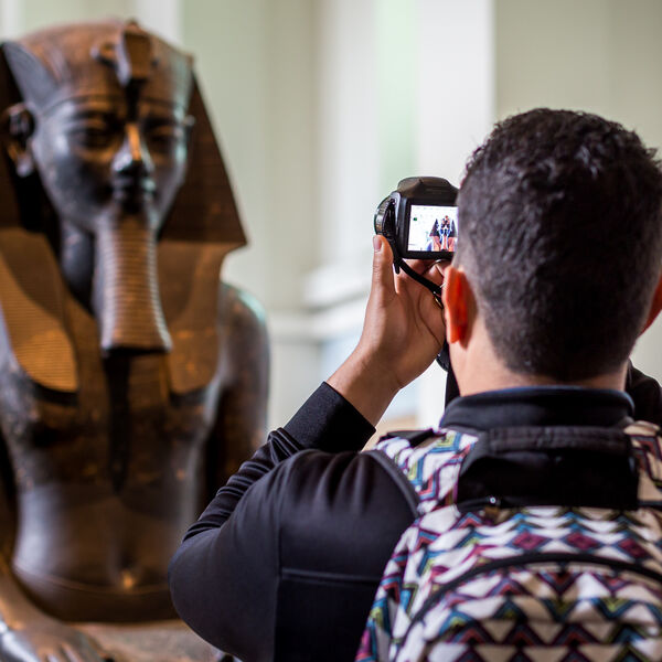 Man taking a picture of Egyptian Pharaoh