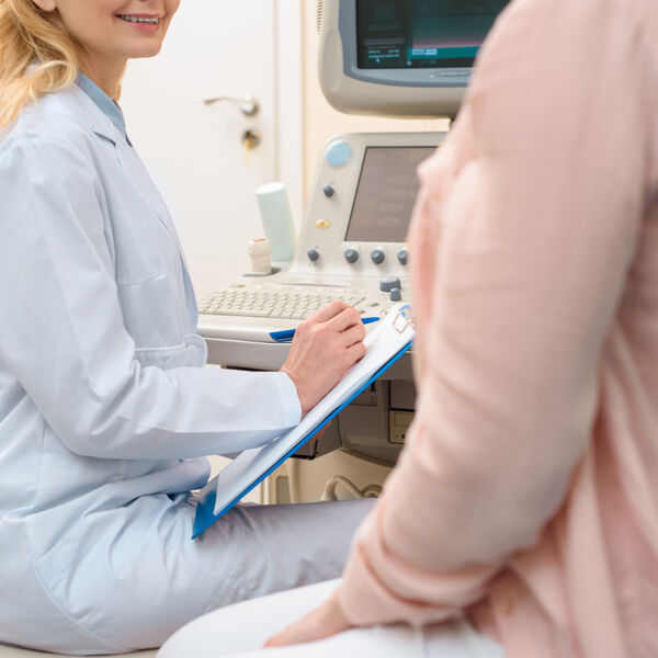 Female doctor with female patient