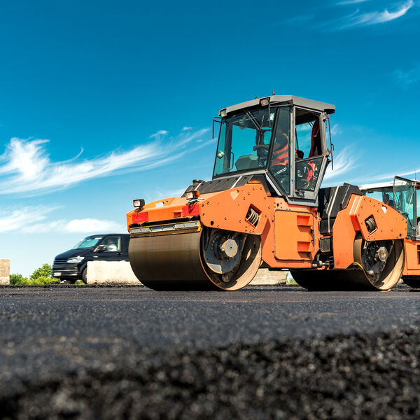 Machines constructing roads