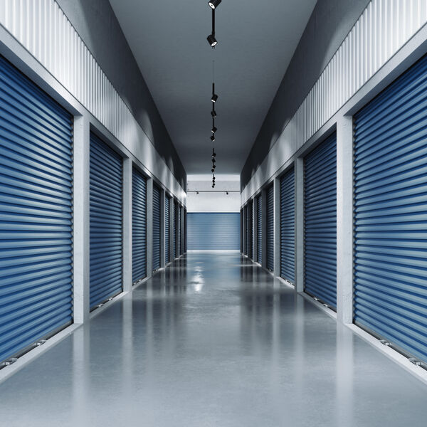 A hallway with indoor storage units 