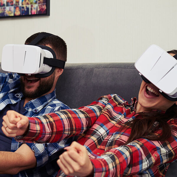 Man and woman using VR headsets